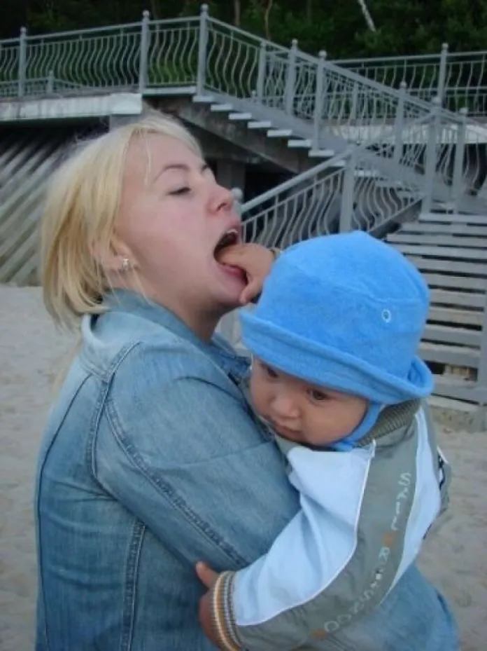 This mom licking her baby