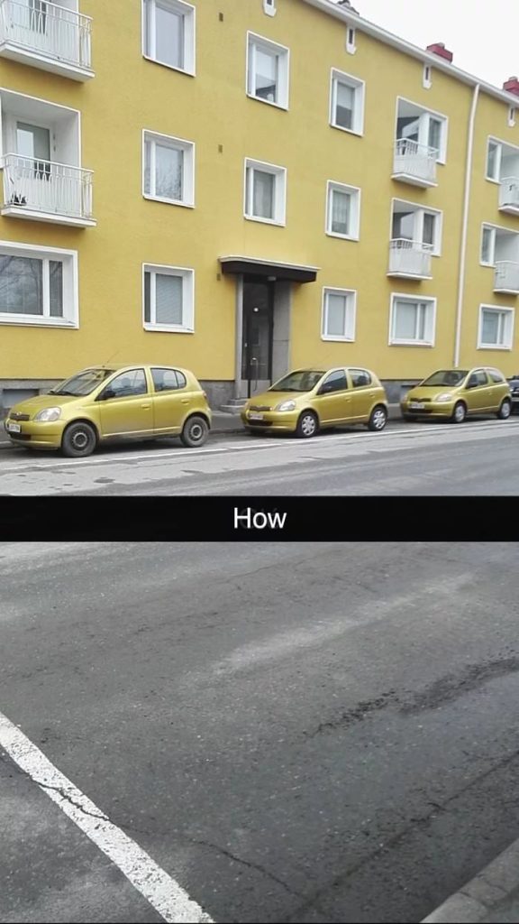 Three cars of the same make, model, and ugly color parked in front of a building with the same ugly color